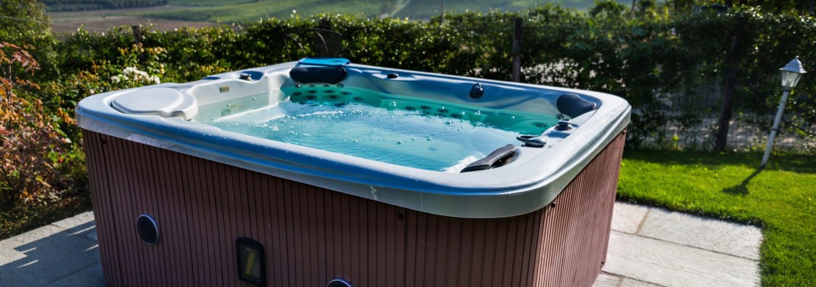 Hot tub in a backyard in need of hot tub removal by Mean Green Junk Removal