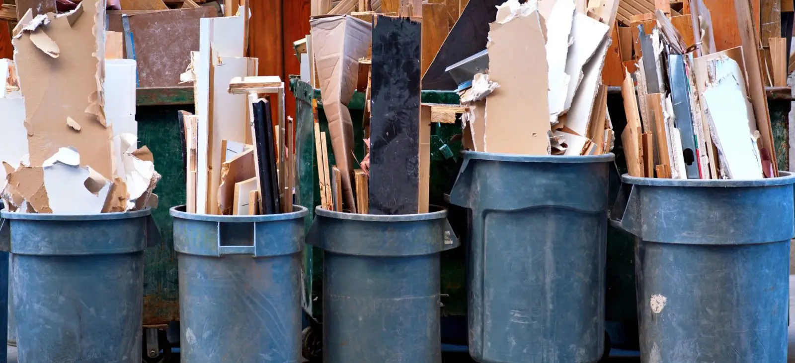 Construction debris in trash containers ready for junk removal in Texas