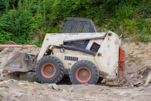 Bobcat skid loader services with Mean Green