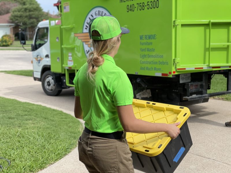 mean green junk removal hauling off boxes for a cleanout services