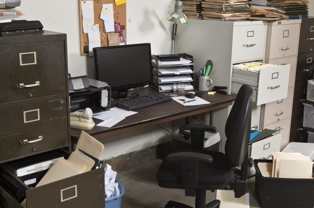 cluttered office that needs office cleanout services by Mean Green