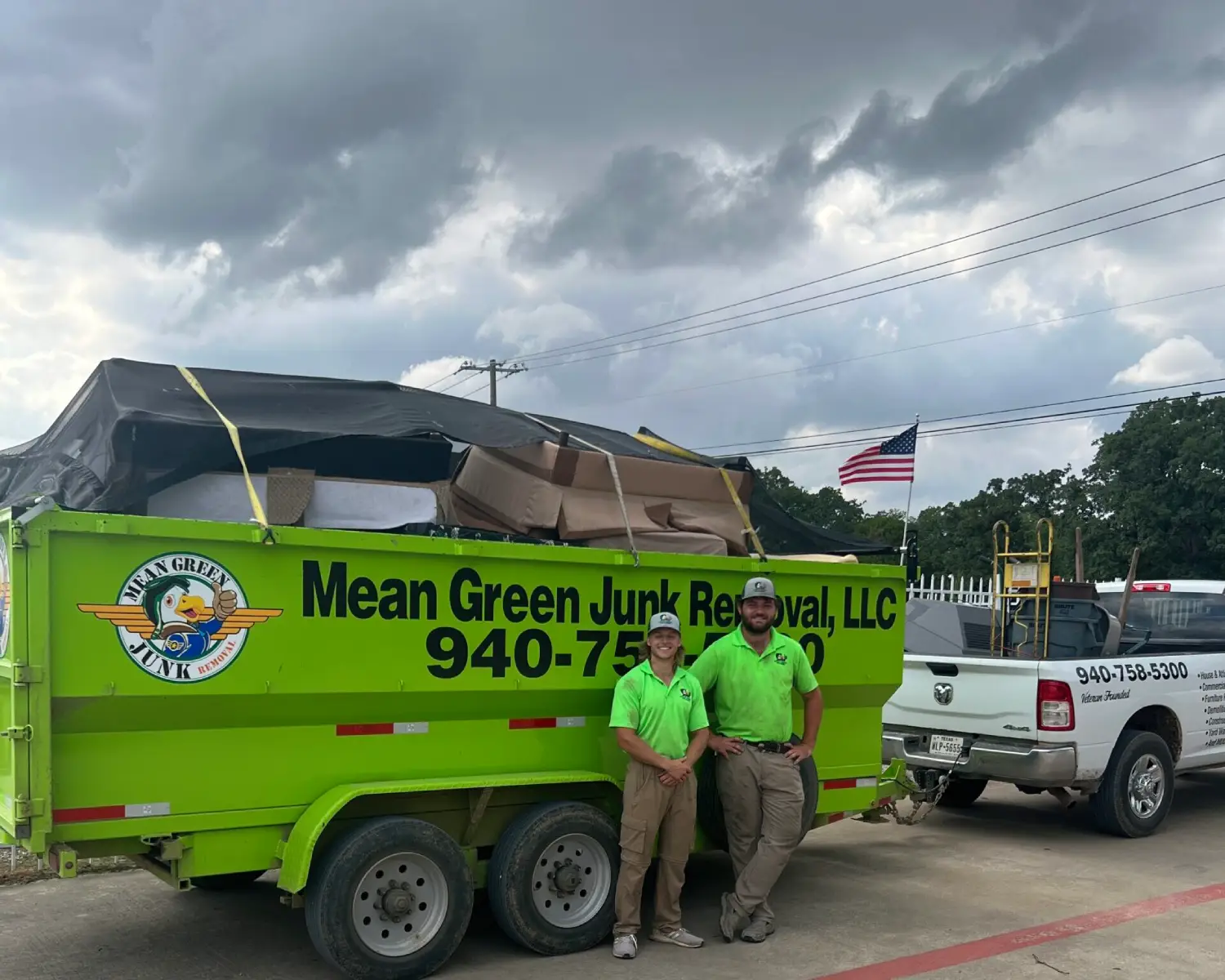 Junk Removal Professionals in front of trailer