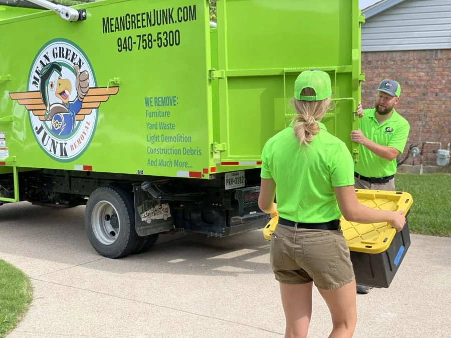 professionals moving junk to truck