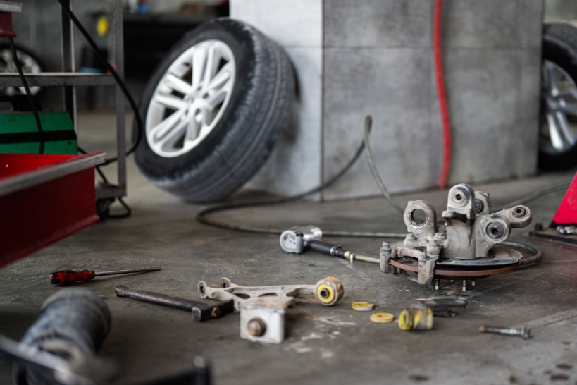 Discarded tires and automotive parts ready for professional junk removal and disposal.
